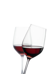 two glasses of red wine with white background