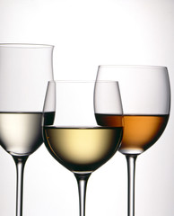 three glasses of wine with a white background