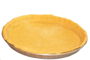 Backblech mit Kuchenteig ausgelegt