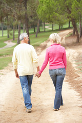 Senior Couple enjoying walk in park