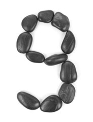 Number '9' made of stones isolated on white