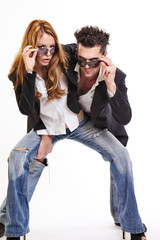 fashion couple look to the camera