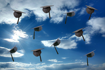 Student graduation hat over sunny sky