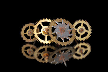 four old rusty clock gears