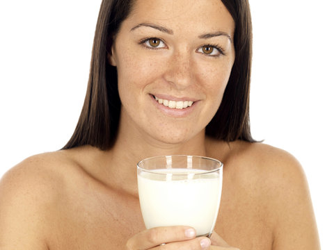 Young Woman Holding Glass of Milk. Model Released
