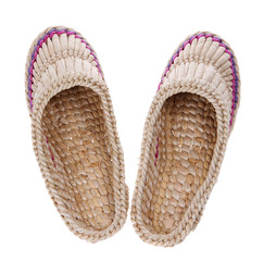 Old Russian sandals made of bark on the white