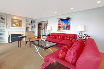 Living room with red, modern furniture