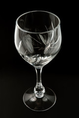 Crystal wineglass over black