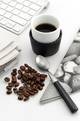 Espresso in small cup with coffee beans