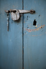 Blue old door with vintage lock.