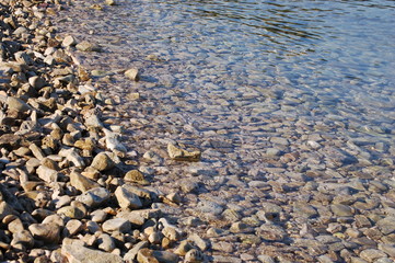 Pebbles in bllue water