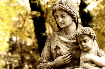 Monument of the woman with the child on a cemetery