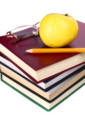 books apple glasses and pencil