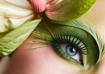 Green eye make-up with flower
