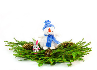 Christmas tree branches with snowman and rabbit