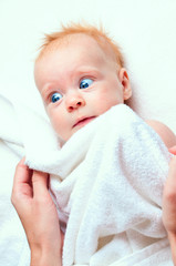 Little baby in white towel