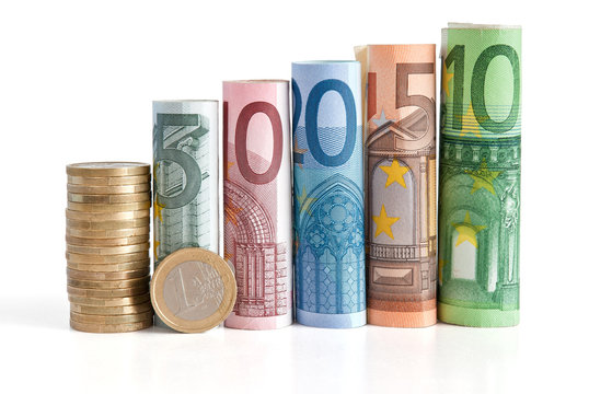 euro rolled bills and coin - euro monete e banconote