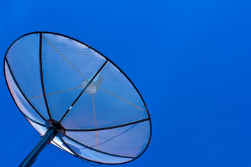 Satellite dish in blue sky