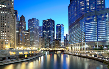 Chicago skyline along the river just after sunset