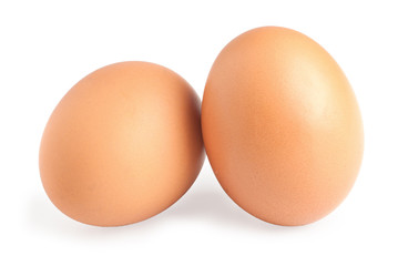 Two brown eggs isolated on white background