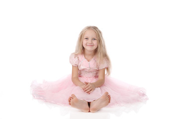 Fototapeta na wymiar little girl in a pink elegant dress.White background