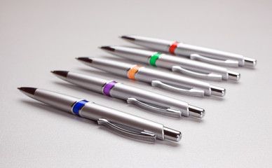 Set of colored pens on table