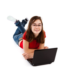Girl using laptop lying on white background © Jacek Chabraszewski
