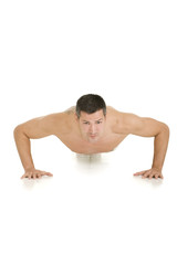 Fototapeta na wymiar bare-chested man does push-ups