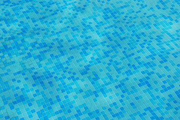 Clean blue water in a swimming pool as background