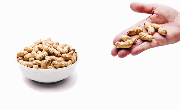 Peanut Bowl and Hand Full of Nuts