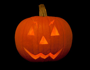 scary halloween pumpkin with face over black background