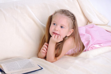 Little girl lying on the couch