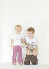 standing children with toys
