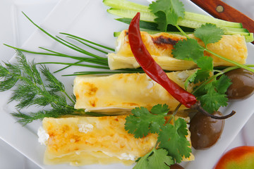 cheese cannelloni on white dish