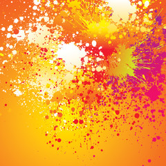 Colorful spots and sprays on orange background