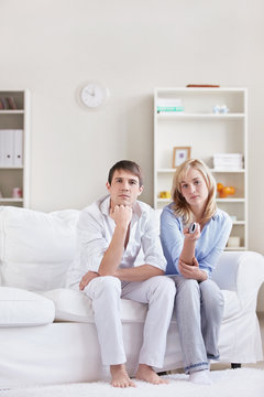Young couple watching TV
