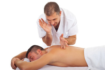 Fototapeta na wymiar Masseur massaging man back