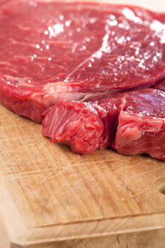 raw casserole beef steak on wood