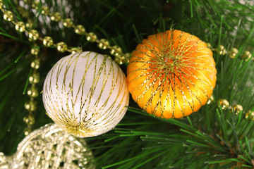 Christmas toy on a branch of a fur-tree