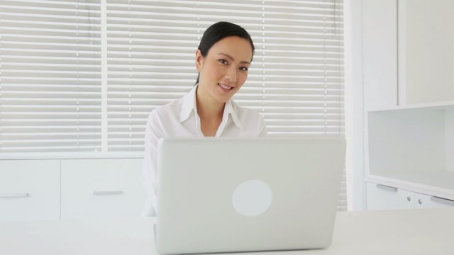 Asian Businesswoman on a Laptop