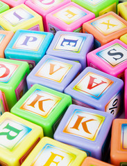 Fototapeta na wymiar Learning and education concept - pile of alphabet blocks