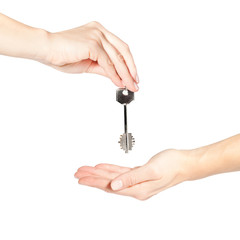 Female hand giving a key