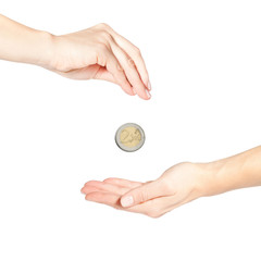 Female hand giving money (coin in motion)