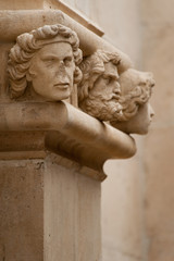 Heads on the facade of St James Cathedral, Sibenic