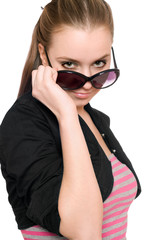 Obraz premium Portrait of pretty young woman in sunglasses