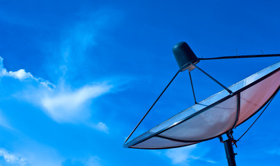 Satellite dish in blue sky