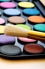 Art concept with painters palette and paint brush