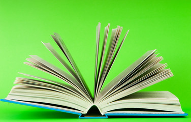 Stack of books on the color background