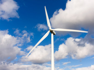 Wind turbine with blue sky as background