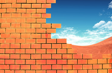 Obraz premium summer meadow through the hole in the brick wall